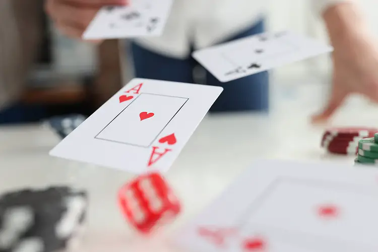 Playing Cards Aces And Dice Flying Over Gaming Table In Casino C