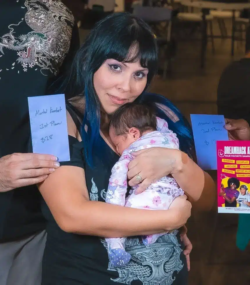 a-woman-won-a-mortal-kombat-tournament-while-holding-her-v0-97vrcl1yx7sf1